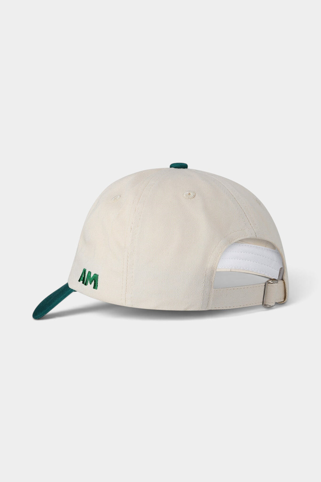 Lockwood Avenue After Midnight creme cap with green brim, button, and AM embroidery on the side