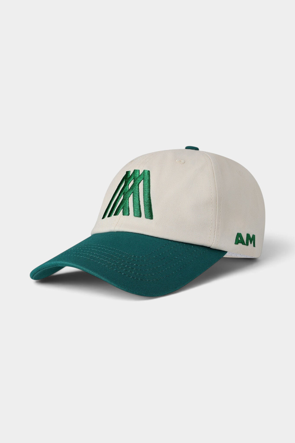 Lockwood Avenue After Midnight creme cap with green brim and green embroidered AM logo on front and side