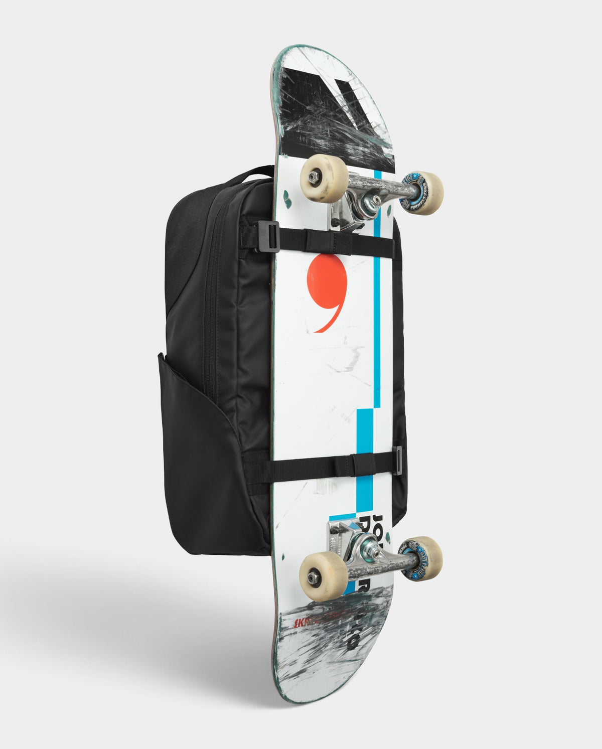 Lockwood Avenue DB Journey 20L black daypack with reinforced Rib-Cage Construction and attached skateboard