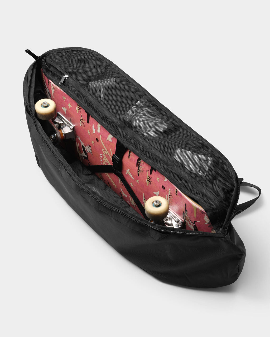 Lockwood Avenue DB Journey Skate 32L carrier in black with a skateboard stored inside the main compartment