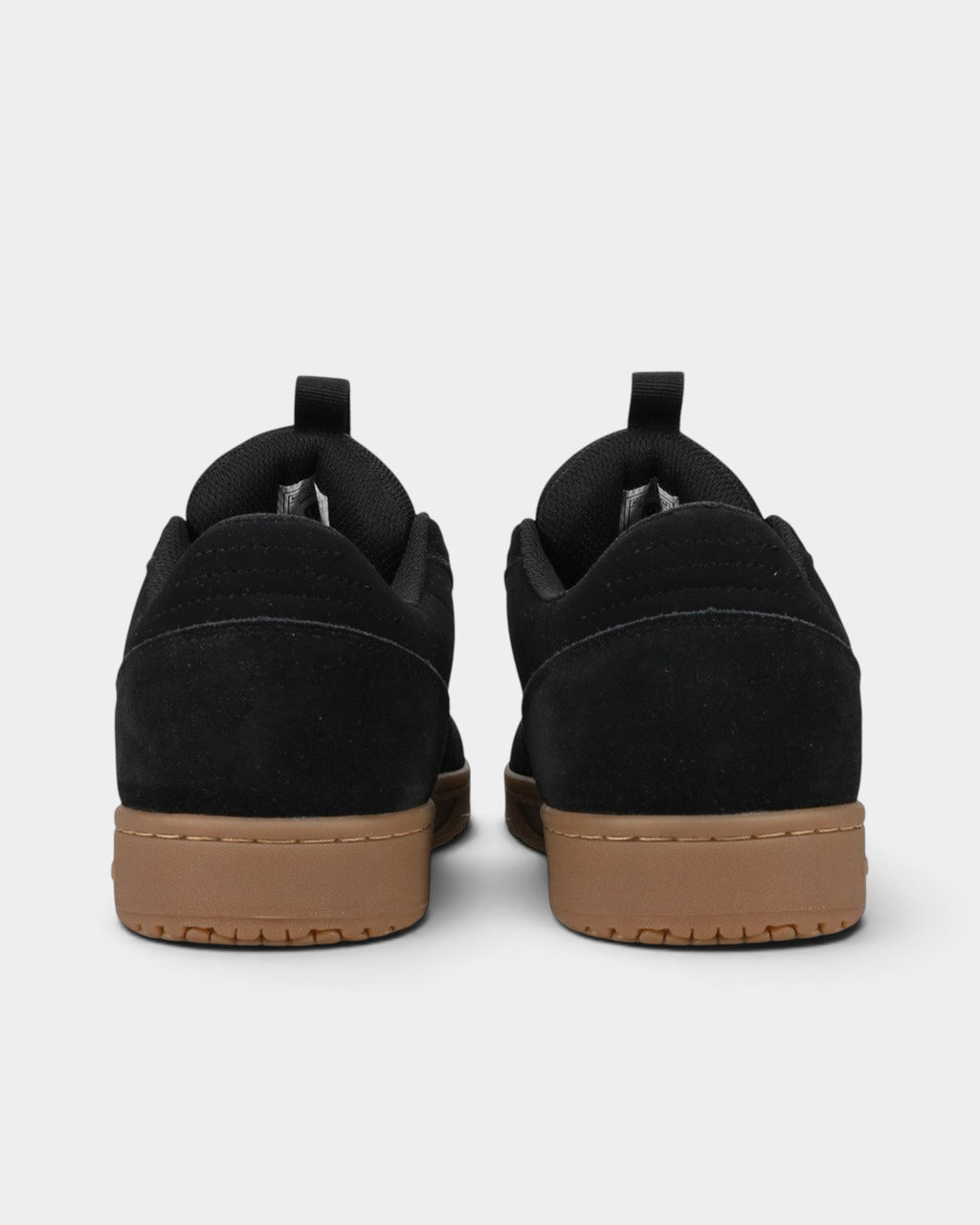 Lockwood Avenue DC Astryx S skate shoes in black Super Suede with a gum rubber cupsole, viewed from the back.