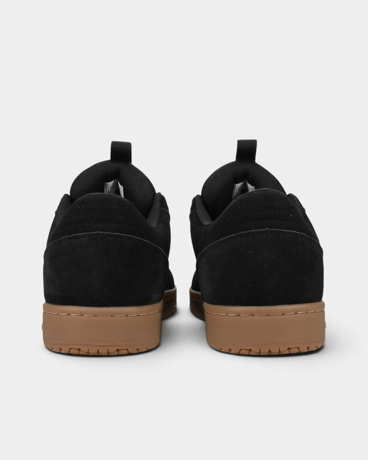 Lockwood Avenue DC Astryx S skate shoes in black Super Suede with a gum rubber cupsole, viewed from the back.
