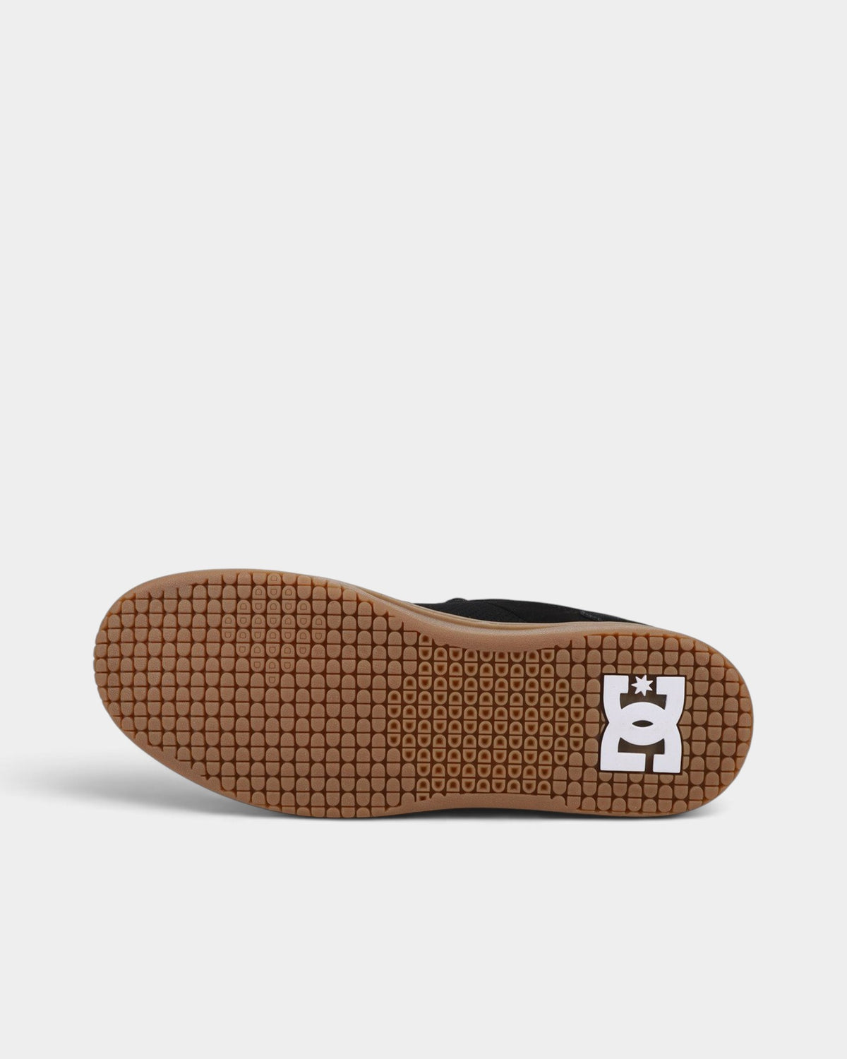 Lockwood Avenue DC Astryx S skate shoe showing the brown rubber outsole with signature pill pattern tread