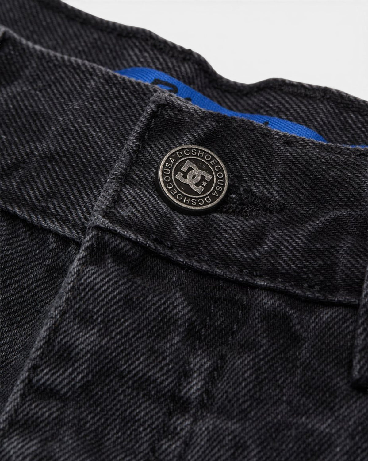 Lockwood Avenue DC Baggy Denim Snake Jeans in black with a branded metal button and blue interior waistband detail.