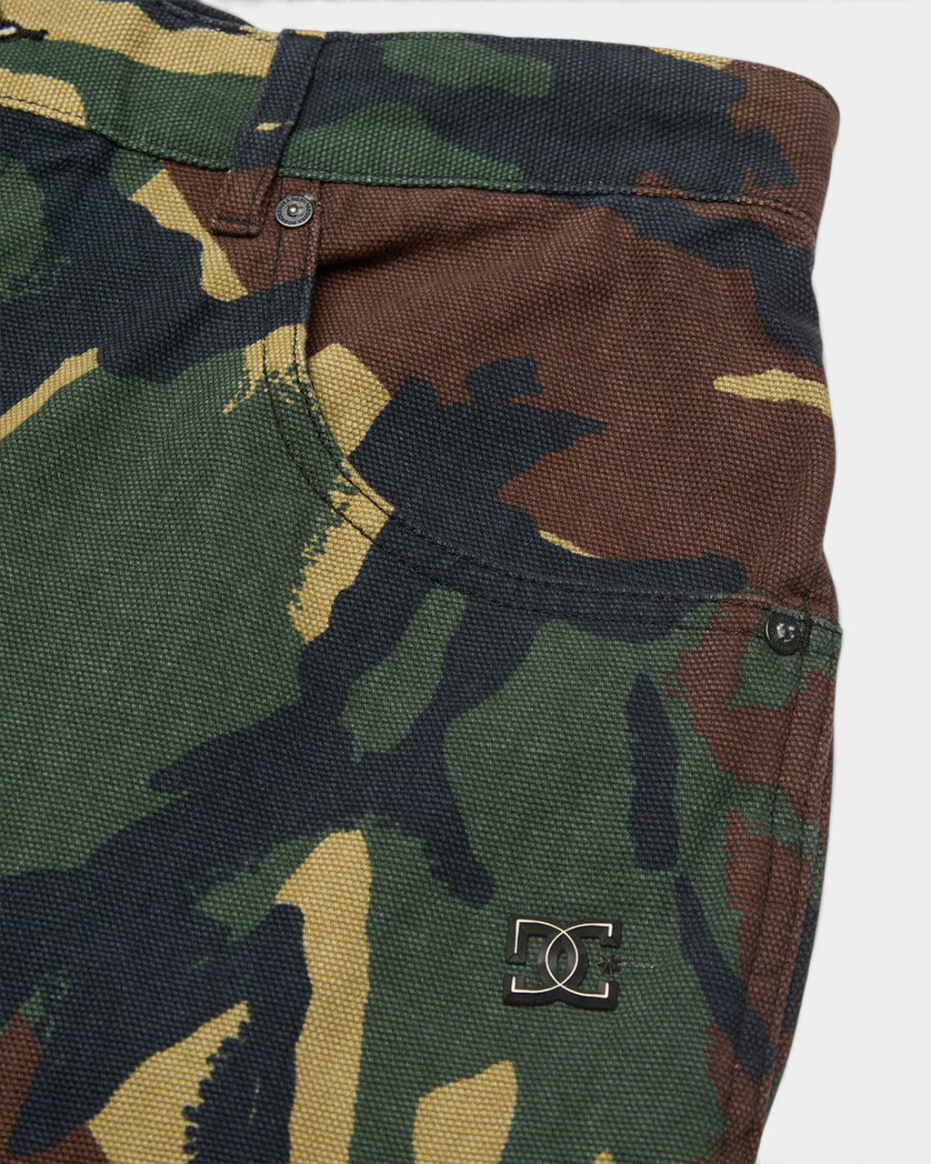 Lockwood Avenue DC Barrel canvas pants in a green, brown, and black camouflage print with a metal logo detail