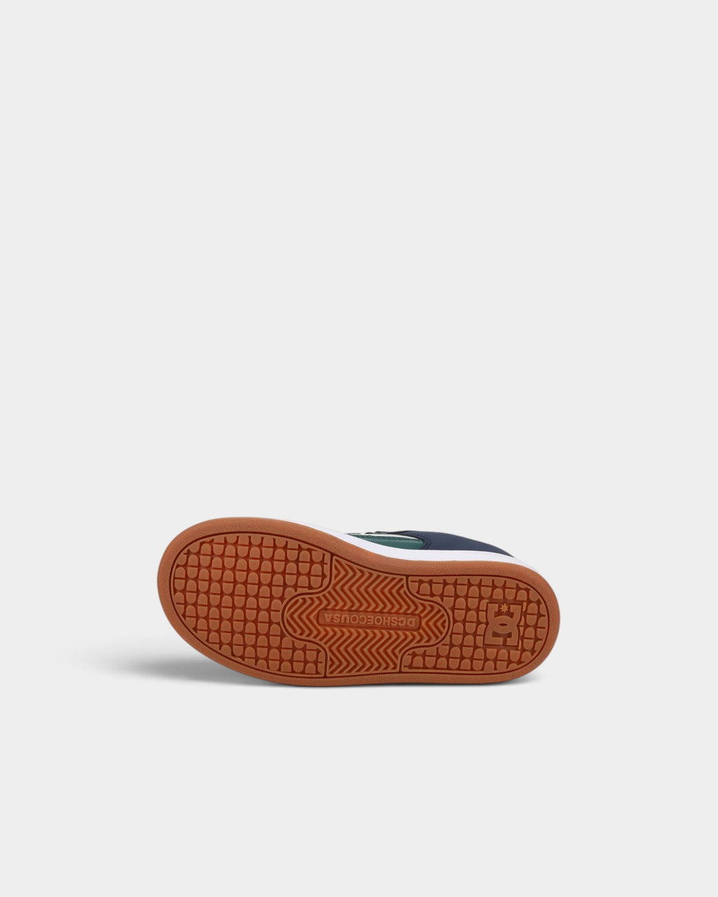 Lockwood Avenue DC Manteca 4 kids skate shoe showing the brown rubber cupsole with signature pill pattern tread