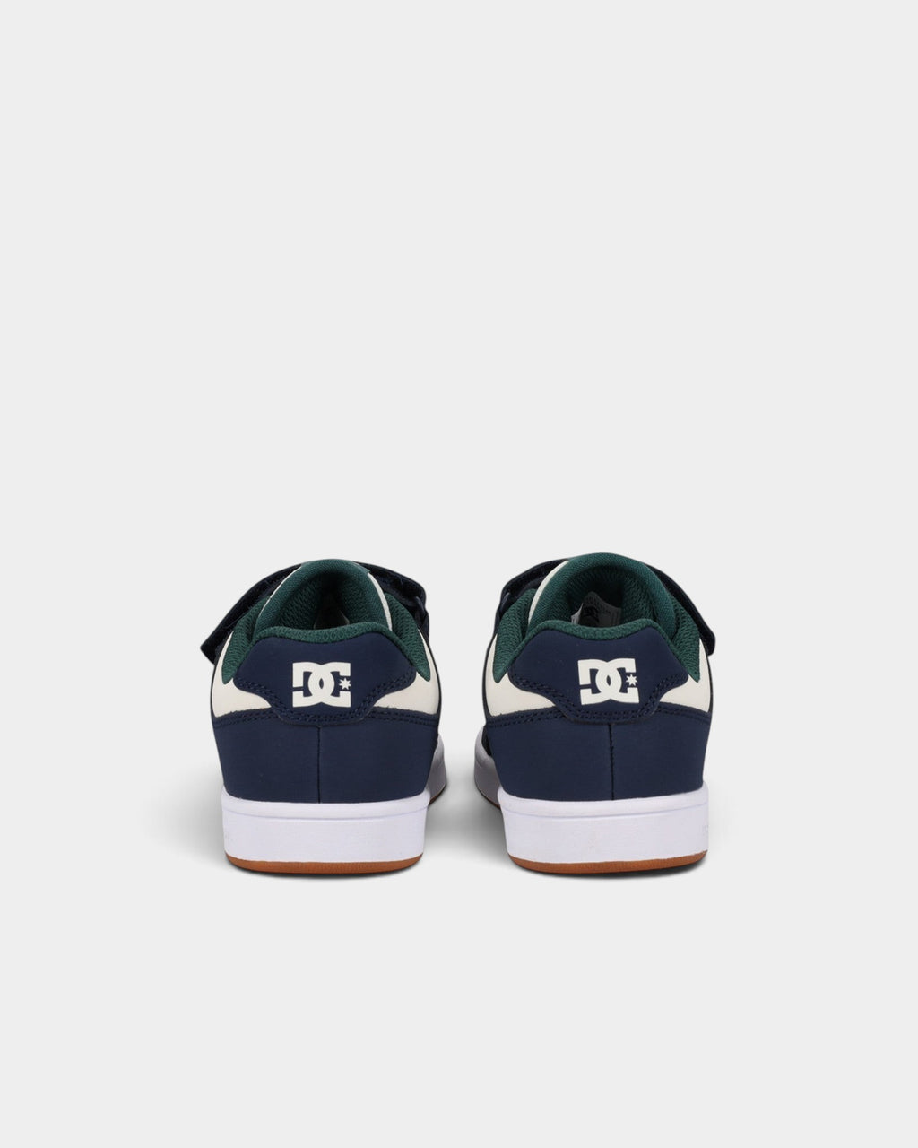 Lockwood Avenue DC Manteca 4 kids skate shoes in navy, white, and green with velcro straps and rubber cupsole