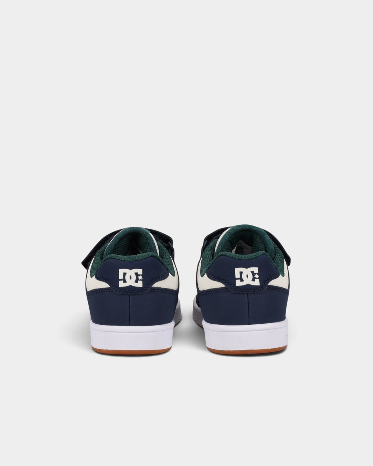 Lockwood Avenue DC Manteca 4 kids skate shoes in navy, white, and green with velcro straps and rubber cupsole