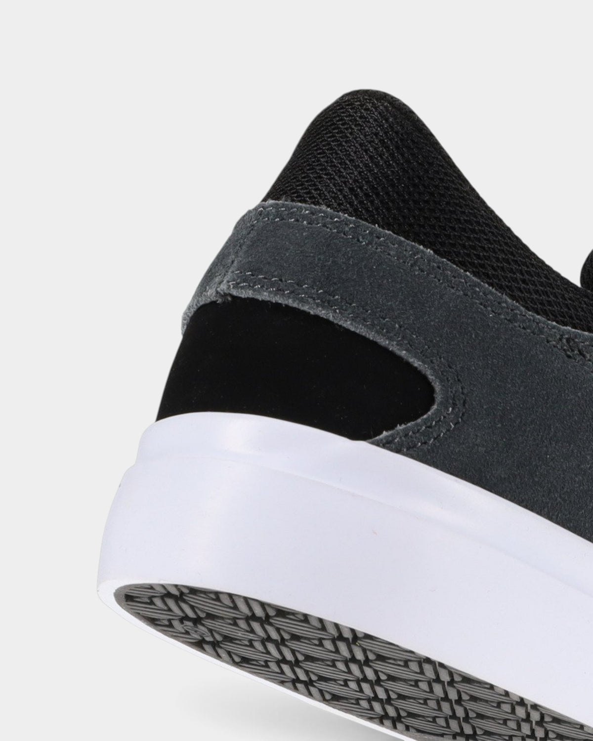 Lockwood Avenue DC Onyx S skate shoe heel detail in black suede and leather with white vulcanized rubber sole