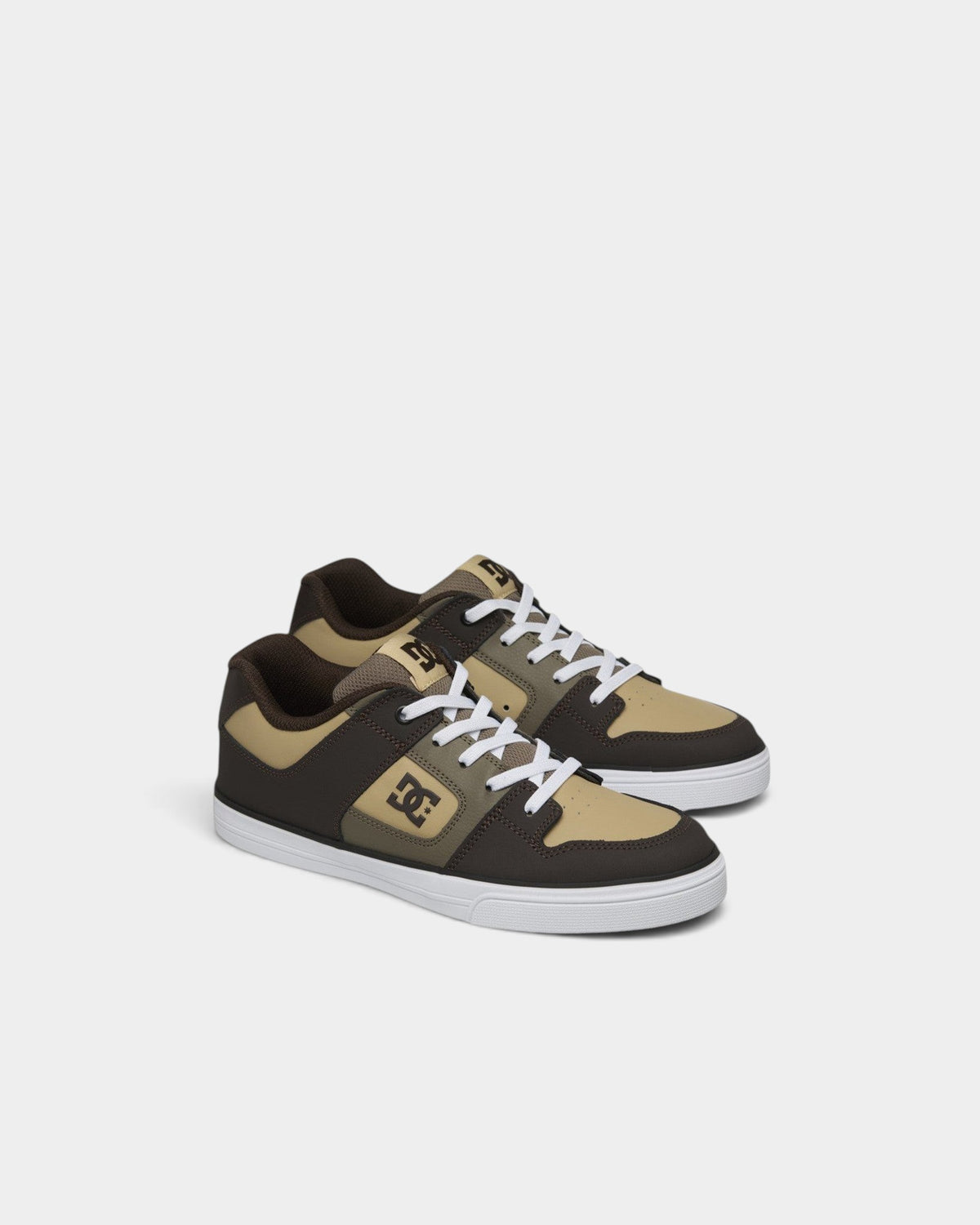 Lockwood Avenue DC Pure kids' skate shoes in brown and tan leather with elastic laces and white rubber soles.