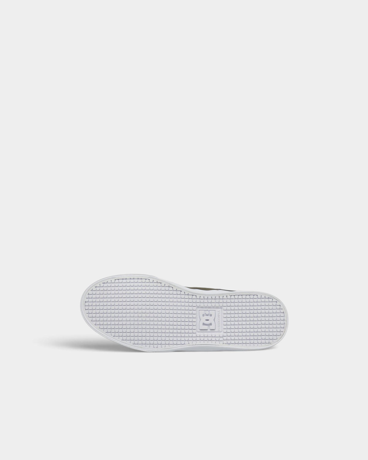 Lockwood Avenue DC Pure elastic kids' shoe showing the white rubber outsole with signature Pill Pattern tread