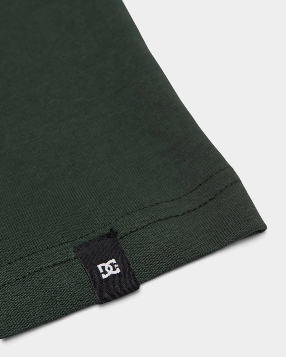 Lockwood Avenue DC Shoes youth t-shirt in dark green cotton jersey with a small branded hem label
