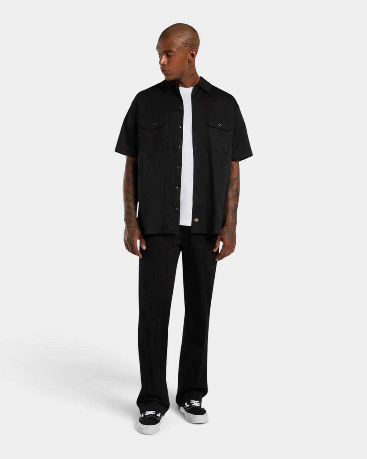 Lockwood Avenue model wearing black Dickies 247 regular work pants with a straight fit and tailored crease