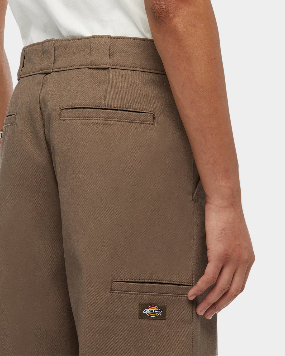 Lockwood Avenue Dickies 247 loose work pants in brown poly-cotton featuring welt pockets and a back leg logo label.