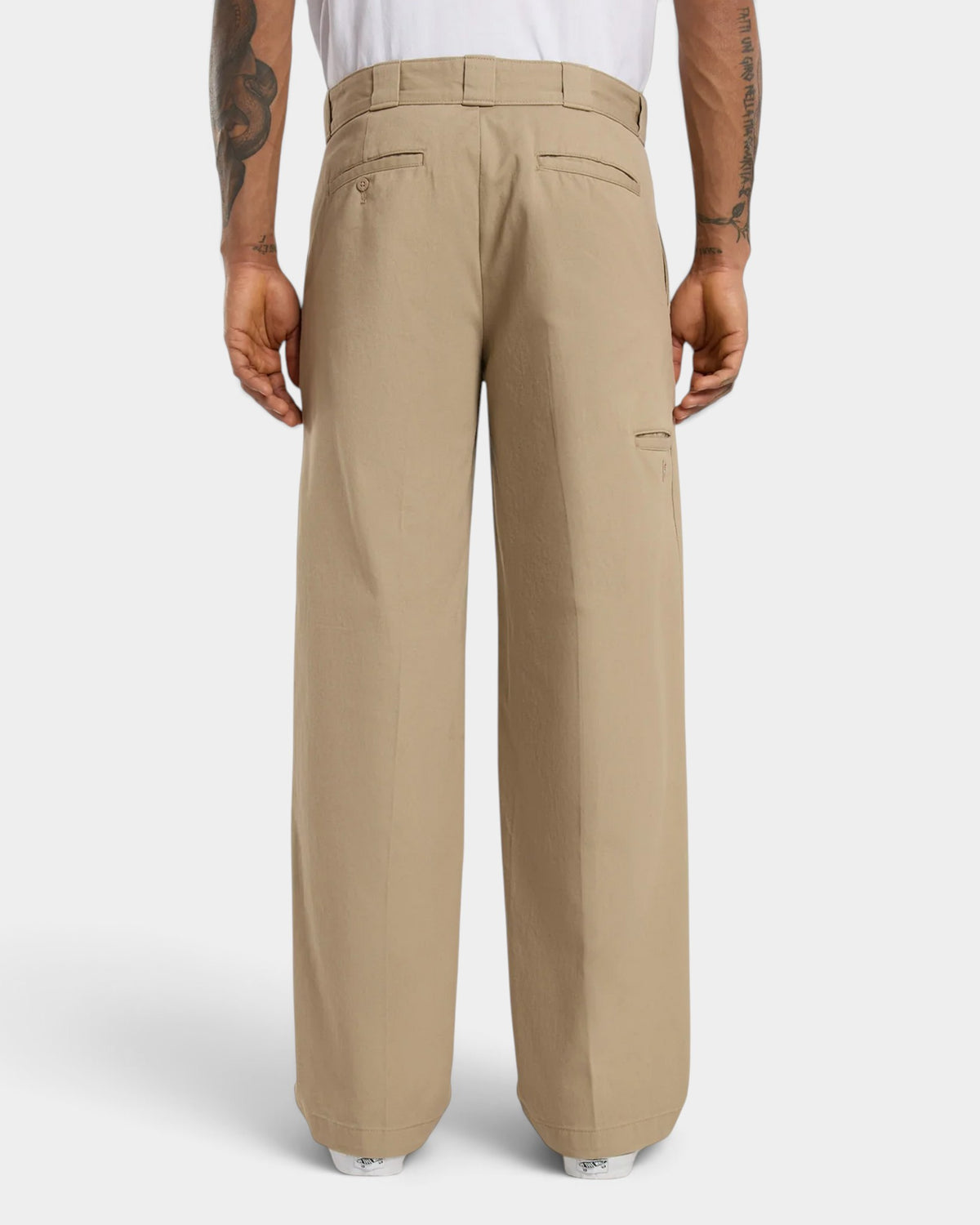Lockwood Avenue Dickies 247 loose work pants in beige cotton twill, back view showing welt pockets and wide fit.
