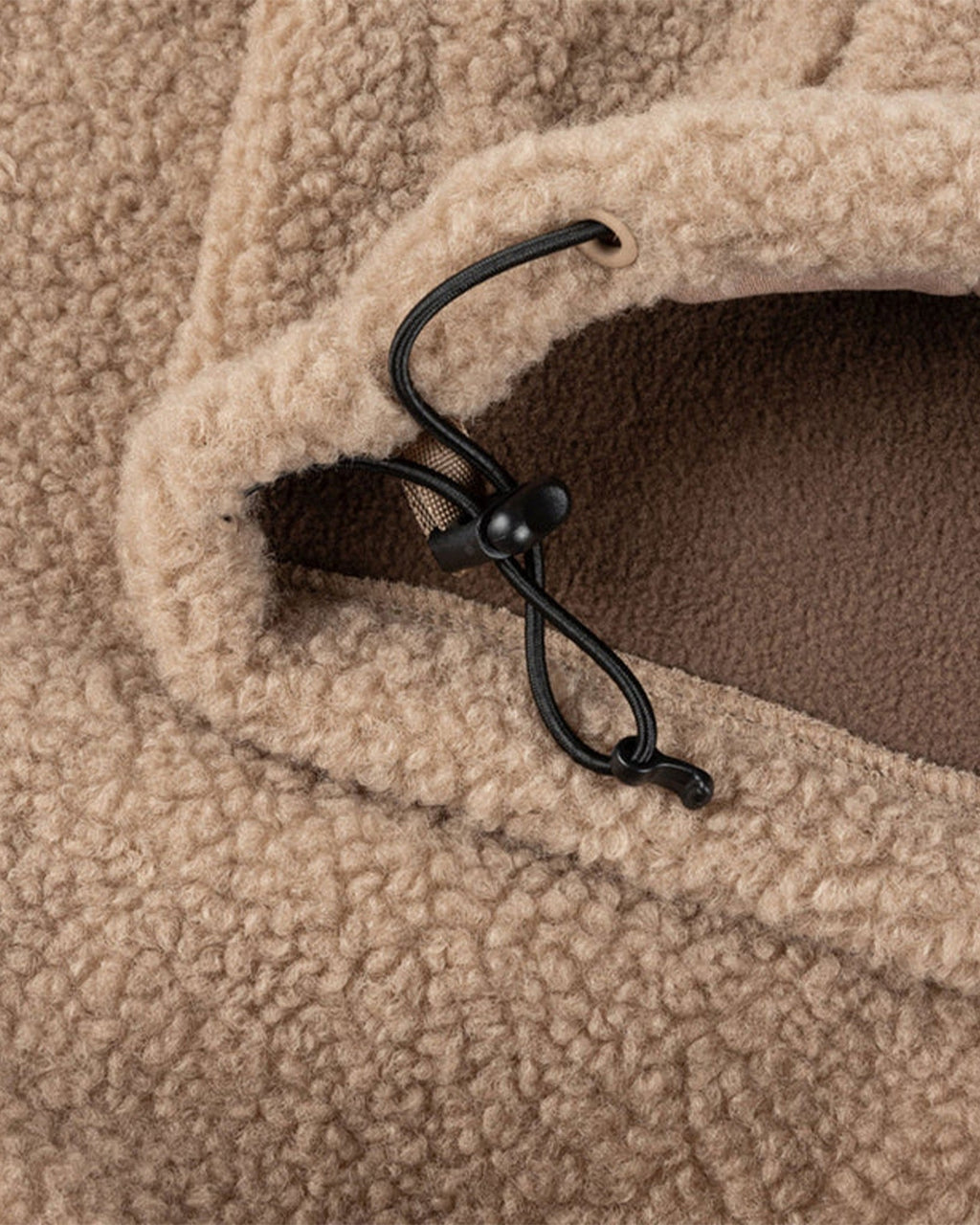 Lockwood Avenue Dime polar fleece sherpa jacket in latte beige with a black adjustable cinch cord at the hem