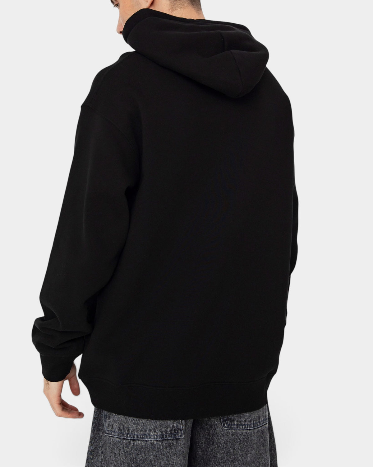 Lockwood Avenue Dime Rawdon black midweight cotton fleece hoodie viewed from the back on a model