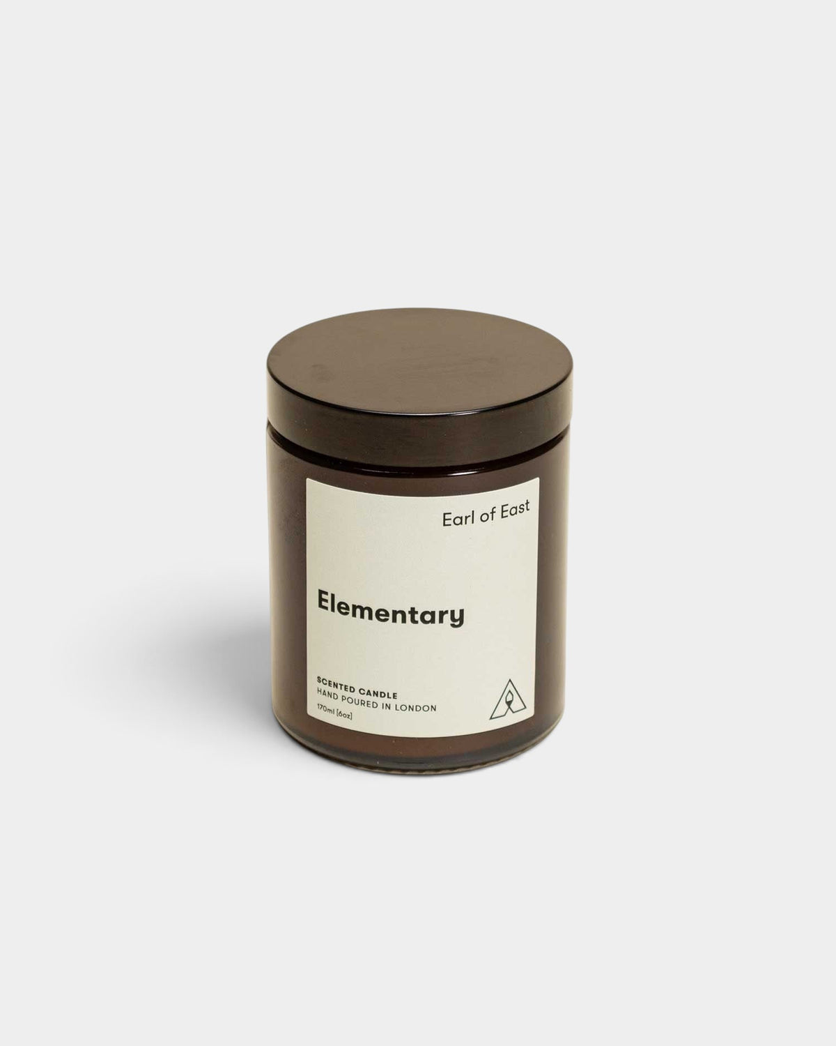 Lockwood Avenue Earl of East Elementary soy wax candle in a recyclable amber glass jar with a black lid