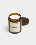 Lockwood Avenue Earl of East Elementary soy wax candle in a recyclable amber glass jar with a black lid
