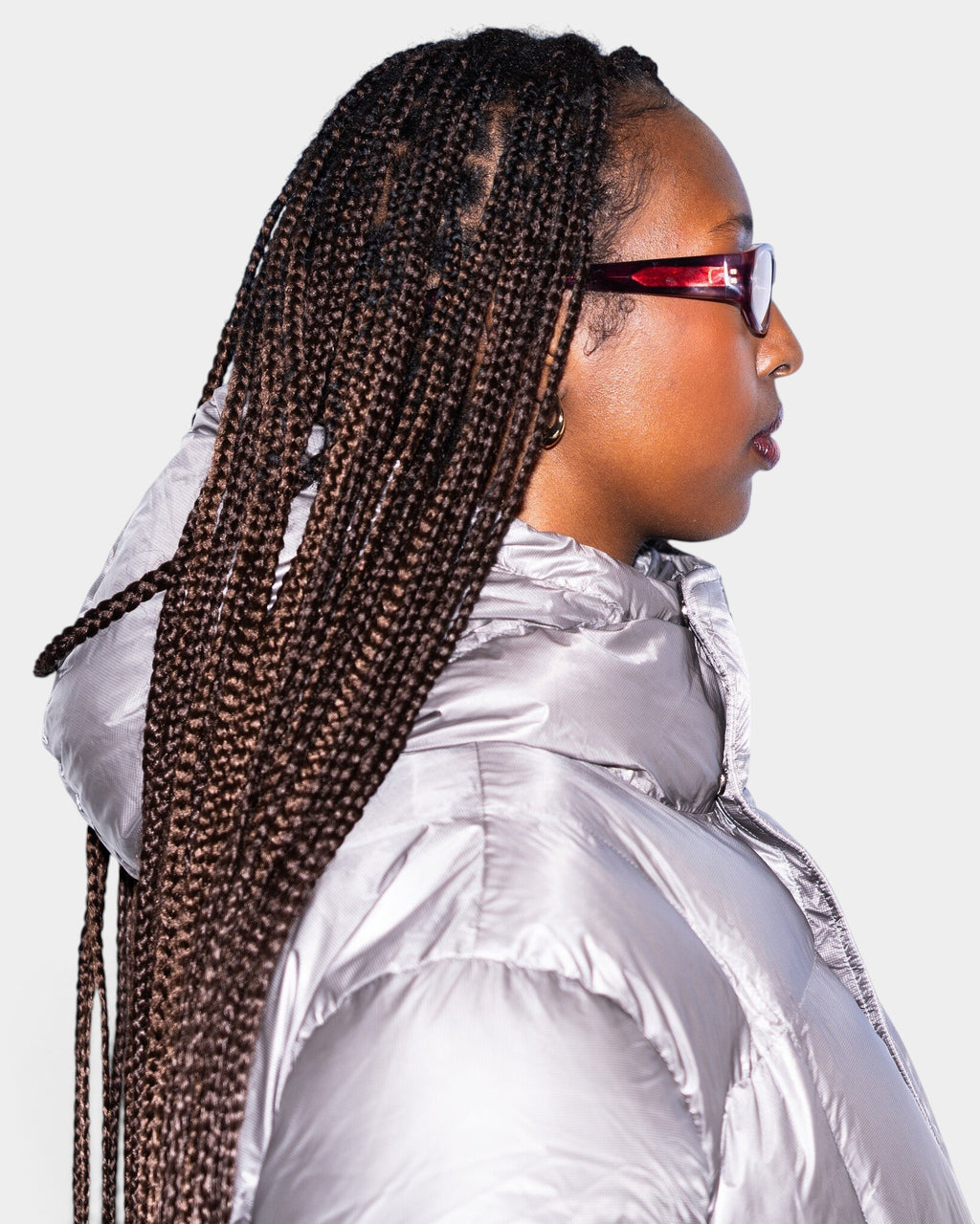 Lockwood Avenue Flatlist Eddie Kyu sunglasses in fantasy pink acetate with peach lenses worn by a woman in profile