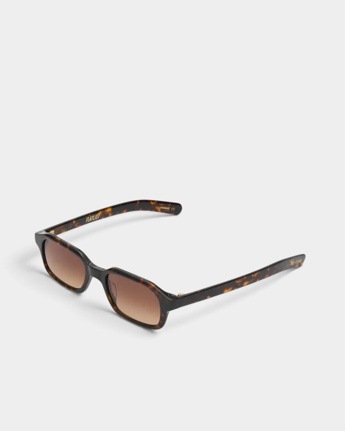 Flatlist Hanky sunglasses in dark tortoise acetate, angled three-quarter view with the temples open and the brown gradient Carl Zeiss lenses