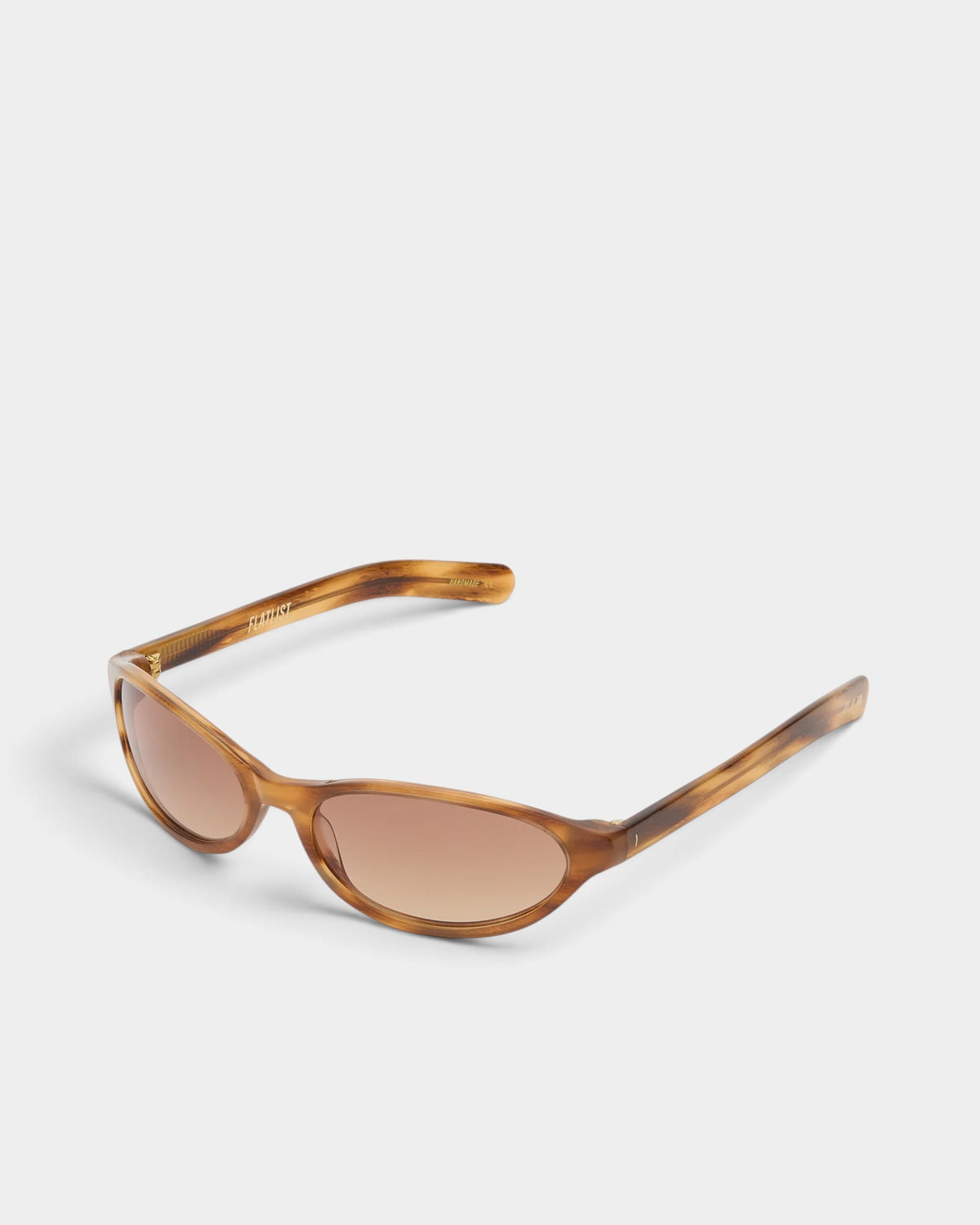 Lockwood Avenue Flatlist Olympia sunglasses featuring a vintage Donegal Horn acetate frame and brown gradient lenses.