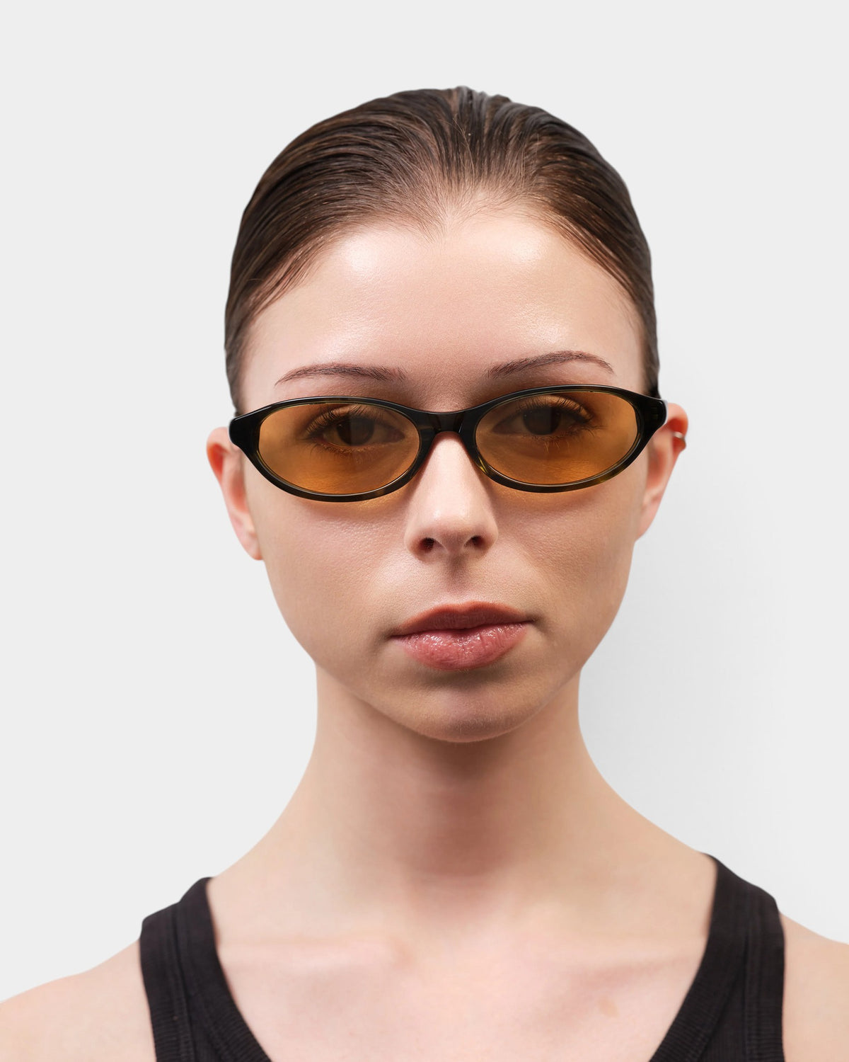 Lockwood Avenue Flatlist Olympia sunglasses with olive horn acetate frames and yellow Carl Zeiss lenses on a model