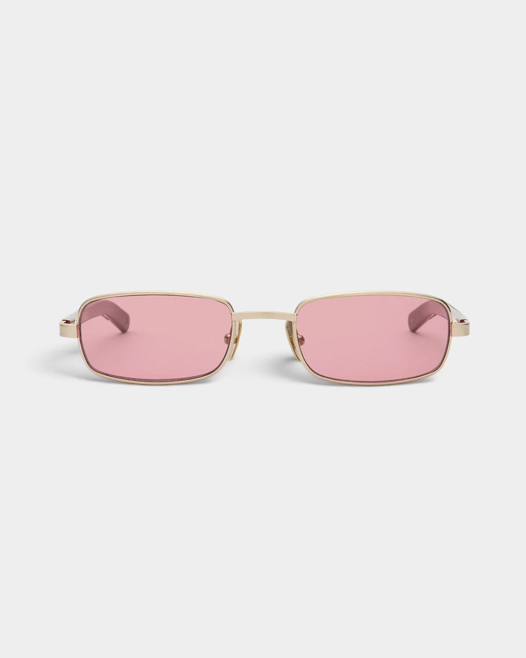 Lockwood Avenue Flatlist Sting sunglasses featuring a brushed light gold titanium frame and pink tinted lenses.