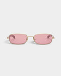 Lockwood Avenue Flatlist Sting sunglasses featuring a brushed light gold titanium frame and pink tinted lenses.