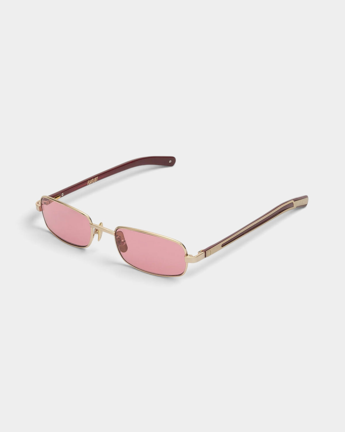 Lockwood Avenue Flatlist Sting sunglasses with brushed light gold titanium frames and pink Carl Zeiss lenses.