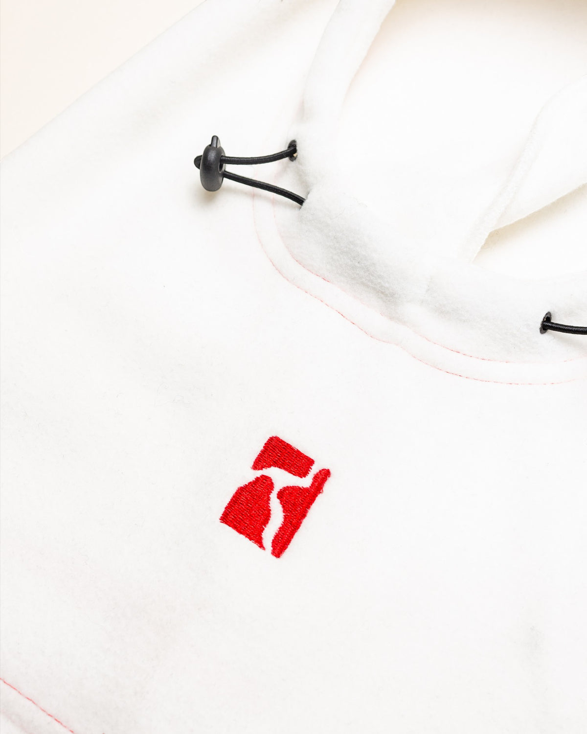 Lockwood Avenue Poetic Collective off-white fleece balaclava with red embroidered logo and adjustable drawstring