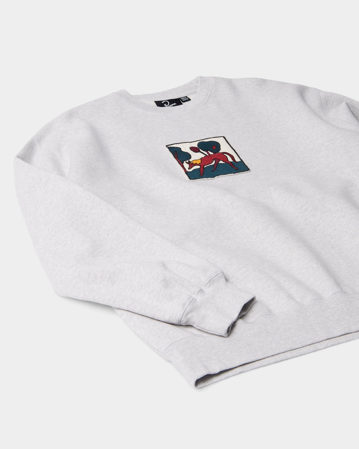 Lockwood Avenue by Parra grey crewneck sweatshirt featuring a raw-edged embroidered fox graphic on the chest.