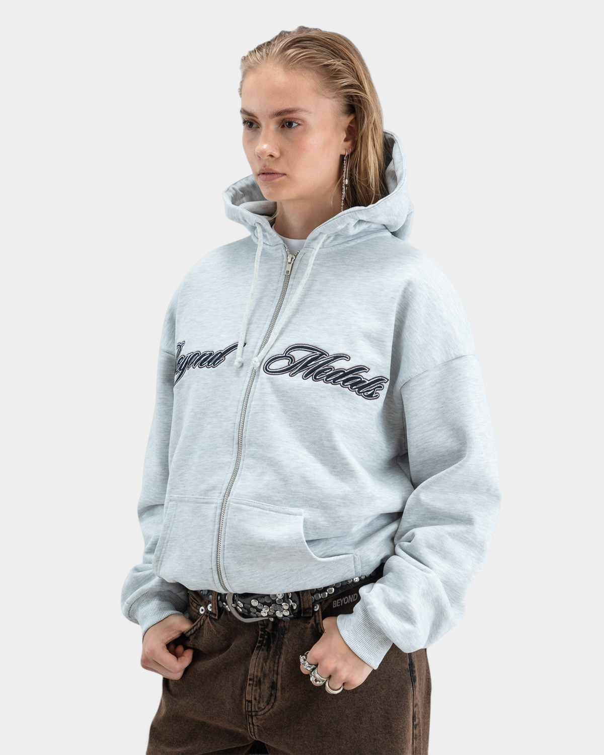 Lockwood Avenue Beyond Medals grey zip hoodie with embroidered script logo, loose fit, and ribbed cuffs.