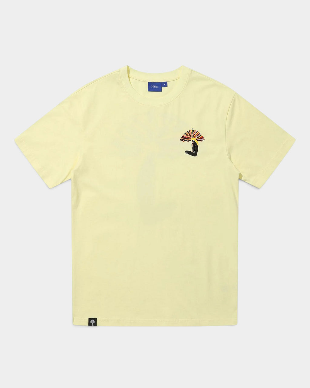 Lockwood Avenue Hélas pastel yellow cotton t-shirt with small sunset umbrella graphic on the chest