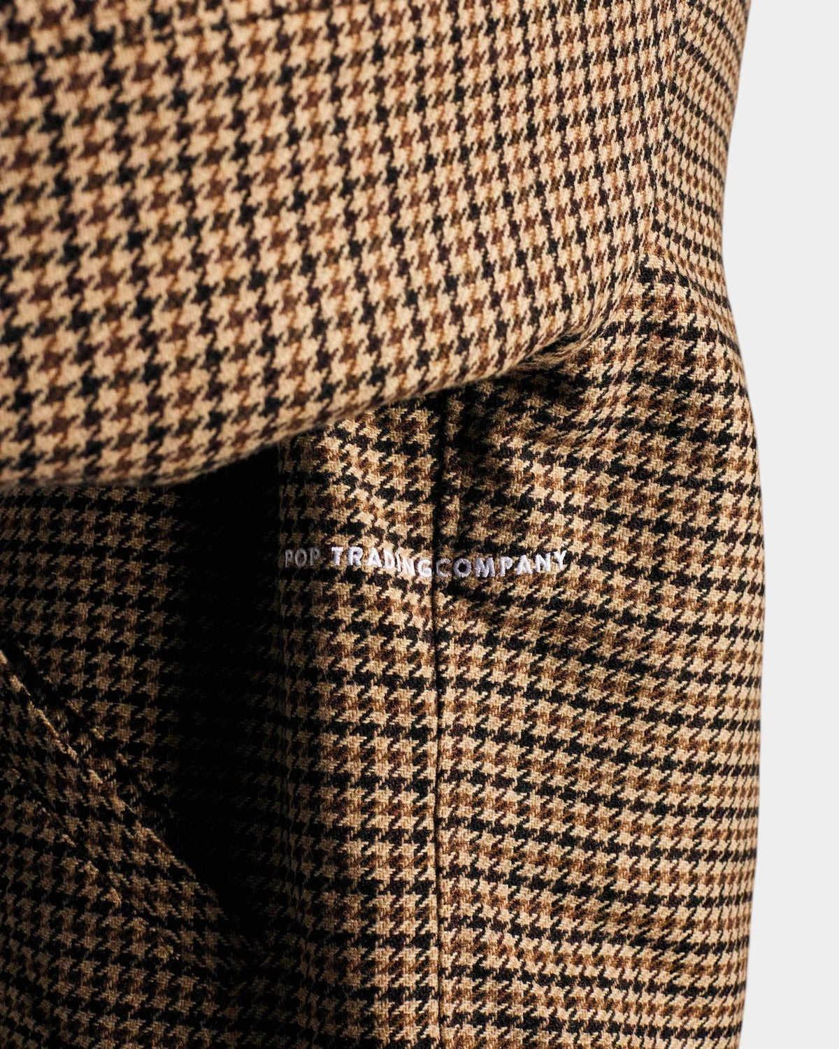 Lockwood Avenue Pop Trading Company wool Harrington jacket in a brown and black houndstooth pattern with logo detail.