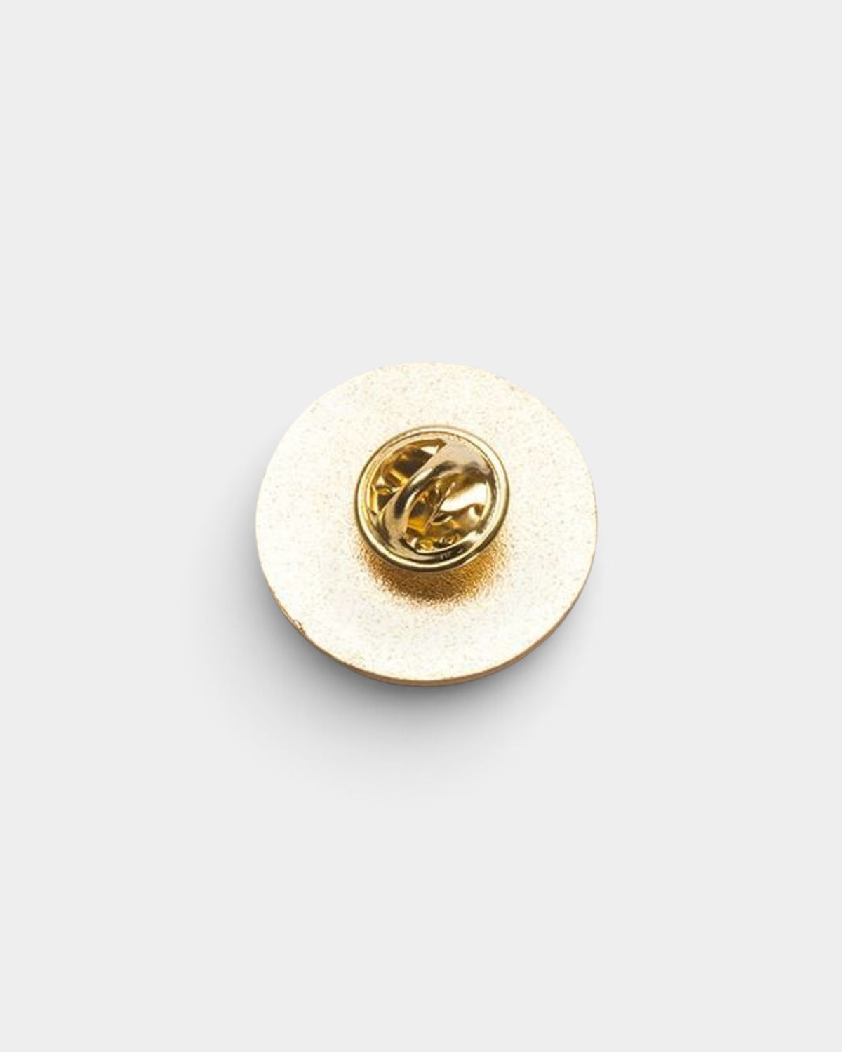 Lockwood Avenue Jenkem round enamel pin back view showing the gold-tone metal finish and secure pin fastening.