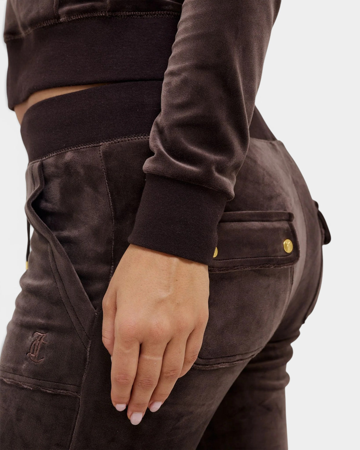Lockwood Avenue Juicy Couture java brown velour track pants with gold-tone hardware and back patch pockets.