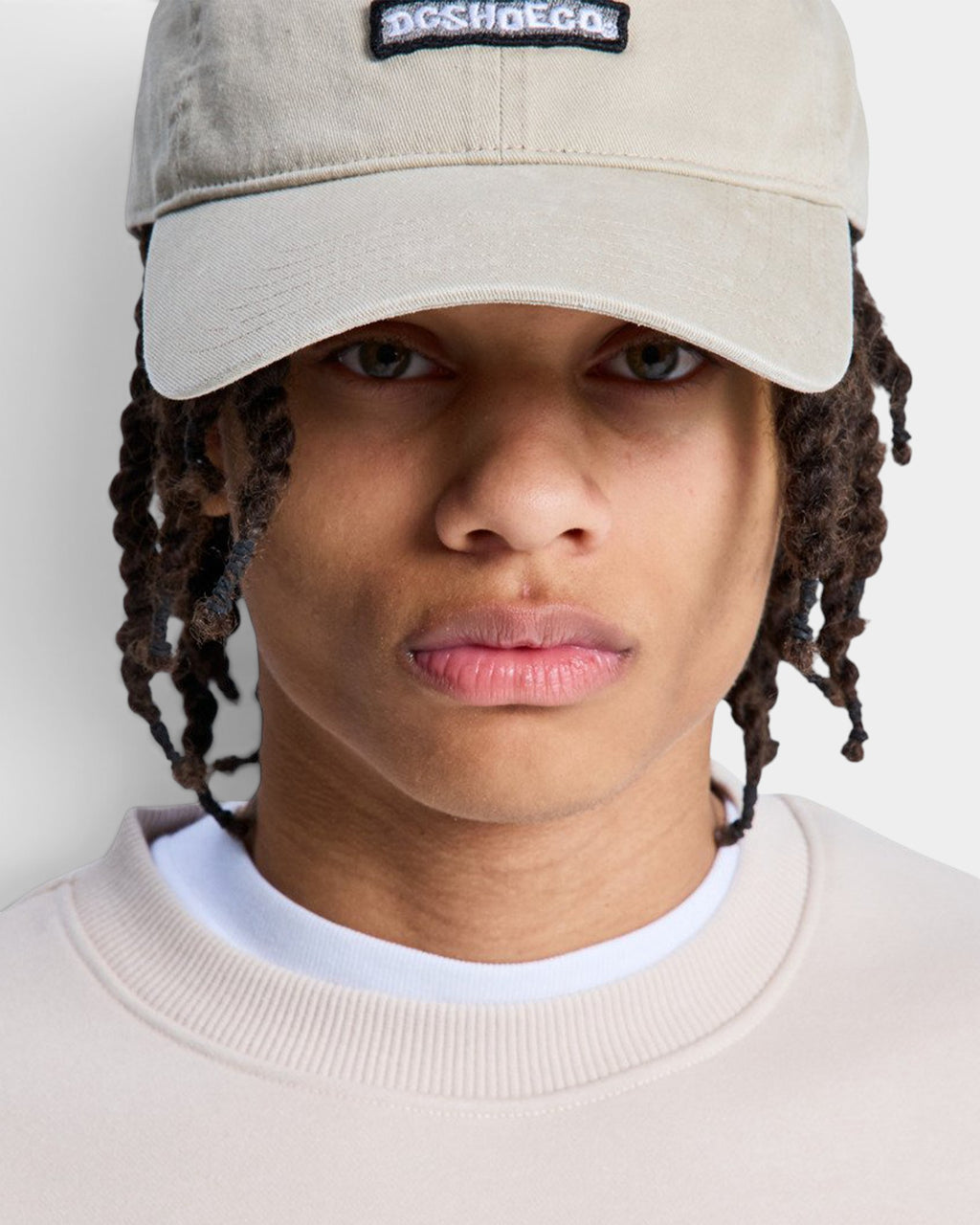 Lockwood Avenue DC Shoes Patch It khaki washed cotton twill unstructured cap with woven logo patch on a model