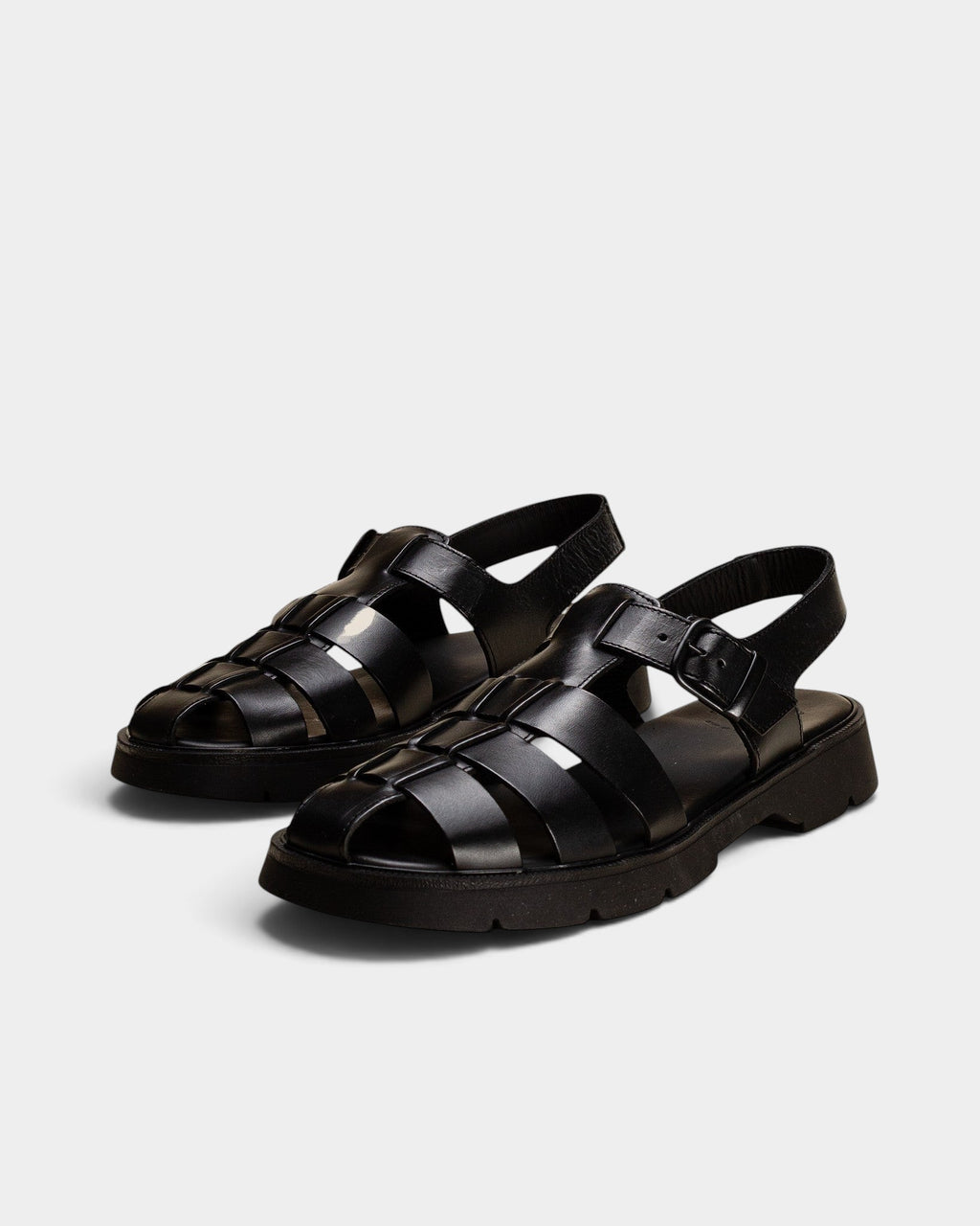 Lockwood Avenue Kleman Babord black vegetable-tanned leather fisherman sandals with a chunky rubber lug sole.