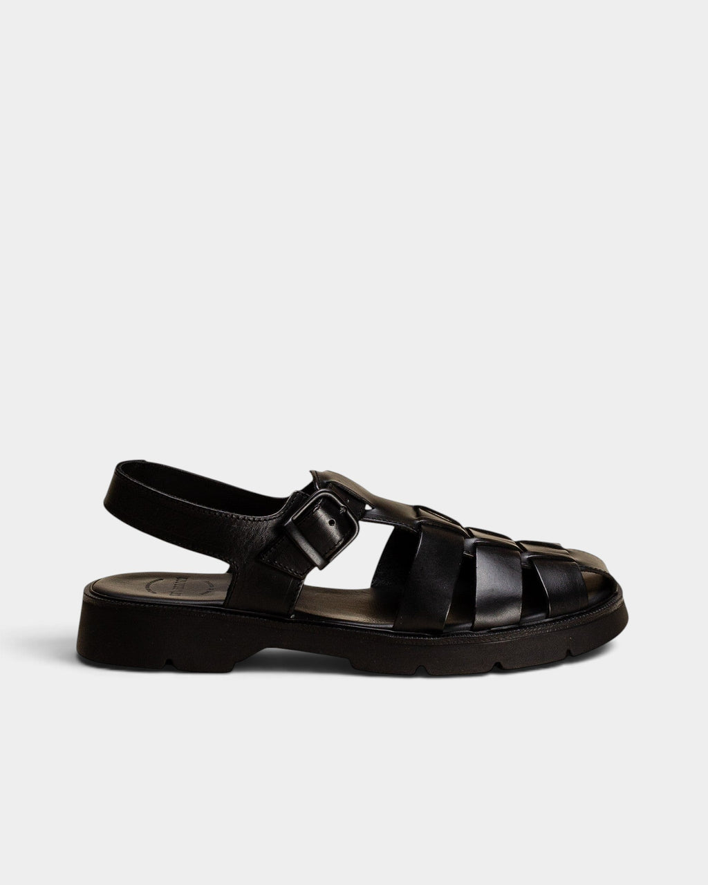 Lockwood Avenue Kleman Babord black vegetable-tanned leather fisherman sandals with a chunky rubber lug sole.
