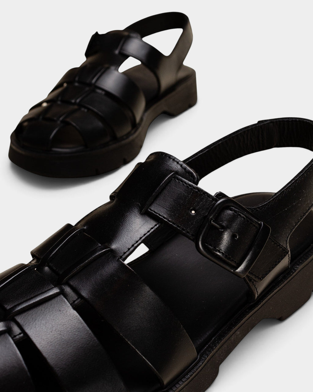 Lockwood Avenue Kleman Babord black vegetable-tanned leather fisherman sandals with chunky rubber lug soles.