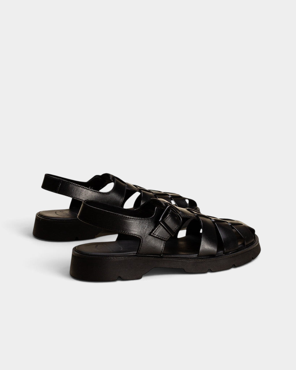 Lockwood Avenue Kleman Babord black vegetable-tanned leather fisherman sandals with a chunky rubber lug sole.