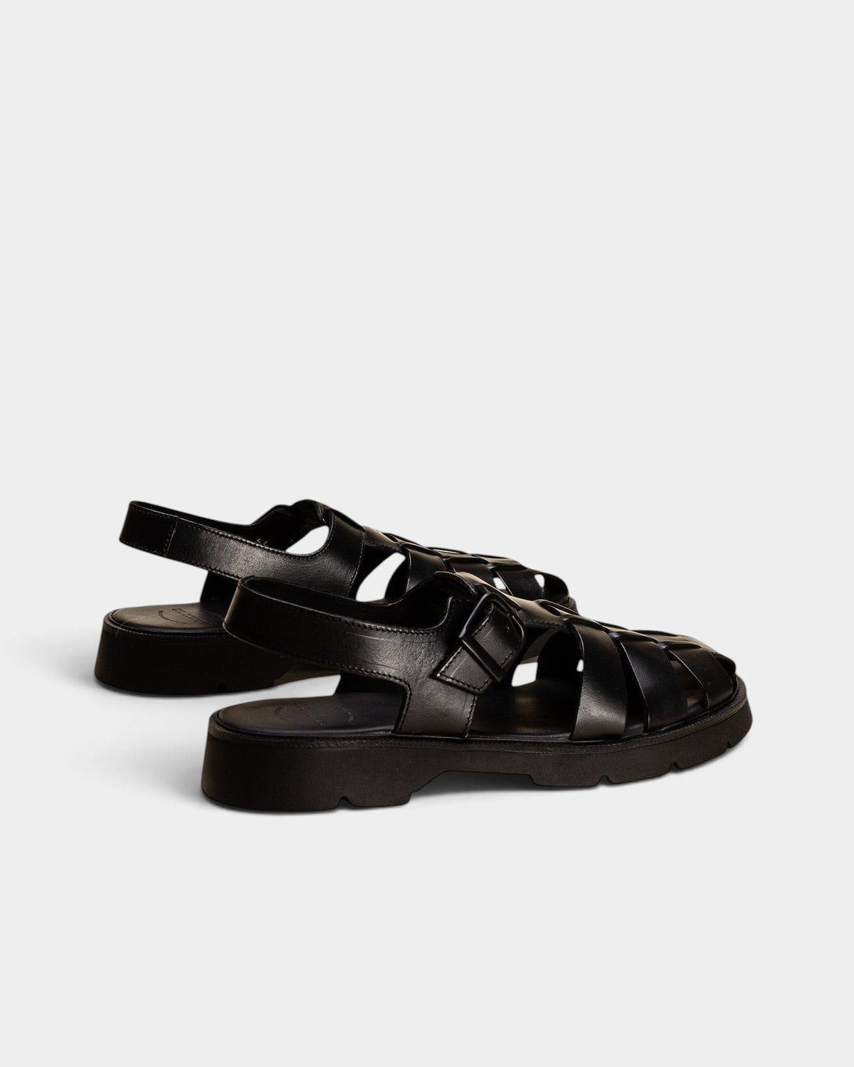 Lockwood Avenue Kleman Babord black vegetable-tanned leather fisherman sandals with a chunky rubber lug sole.