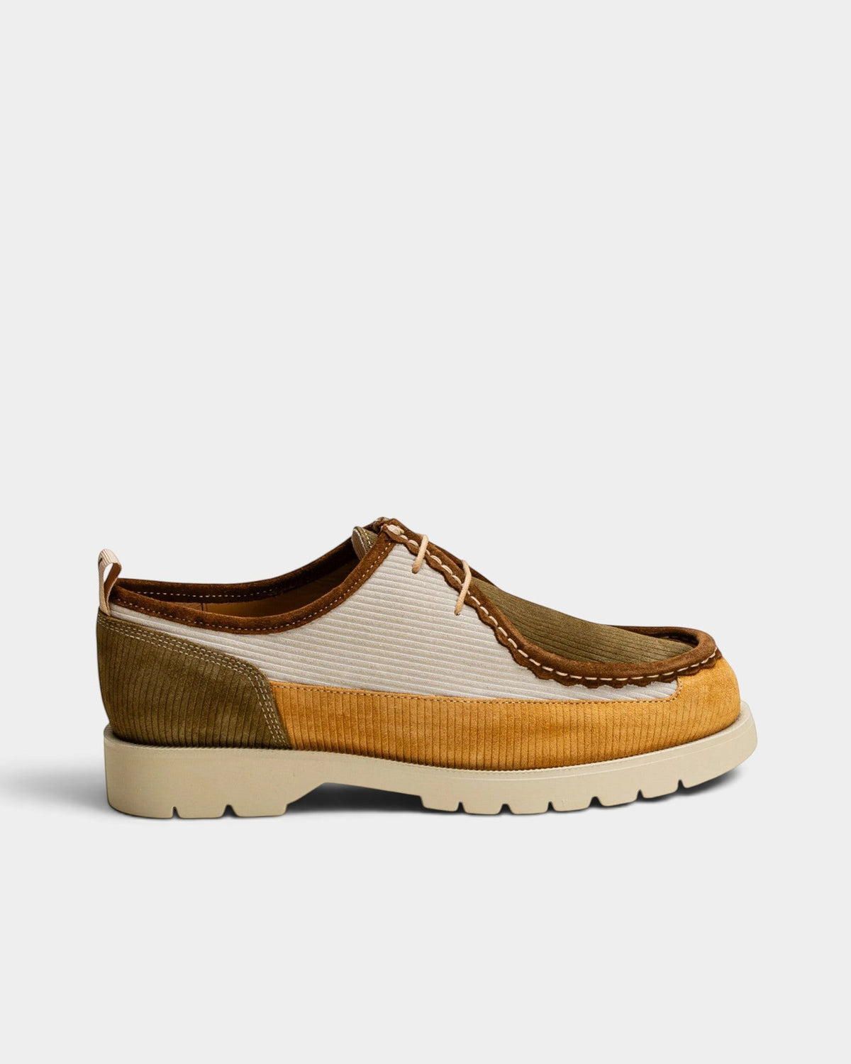 Lockwood Avenue Kleman Bastille low lace-up derby shoes in mustard, ecru, and khaki ribbed suede with a lug sole.