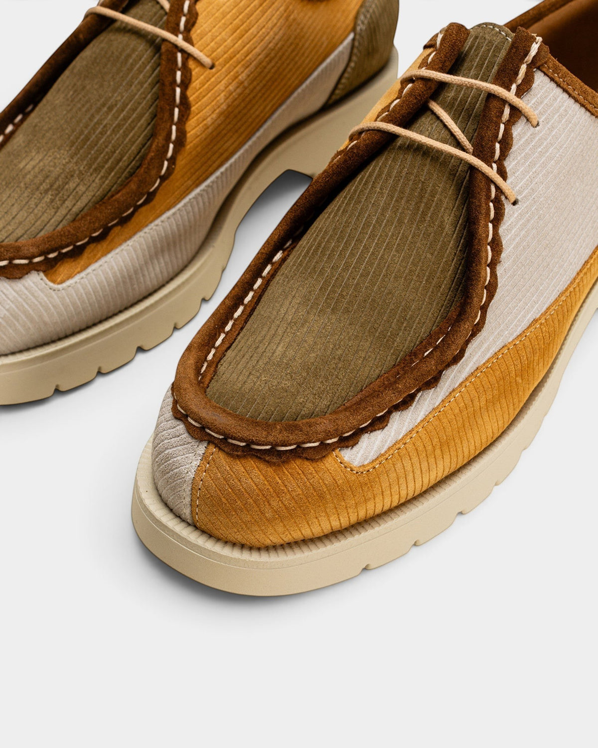 Lockwood Avenue Kleman Bastille derby shoes in mustard, ecru, and khaki ribbed suede with a rubber lug sole.