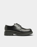 Lockwood Avenue Kleman Chemin black leather derby shoes with a thick durable sole and lace-up closure.
