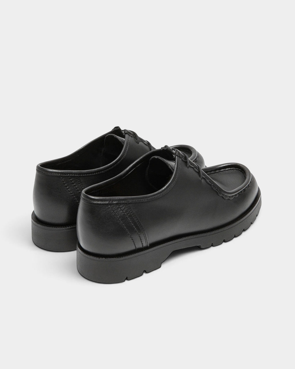 Lockwood Avenue Kleman Padror black full-grain leather derby shoes with chunky rubber lug soles and apron toe detail.