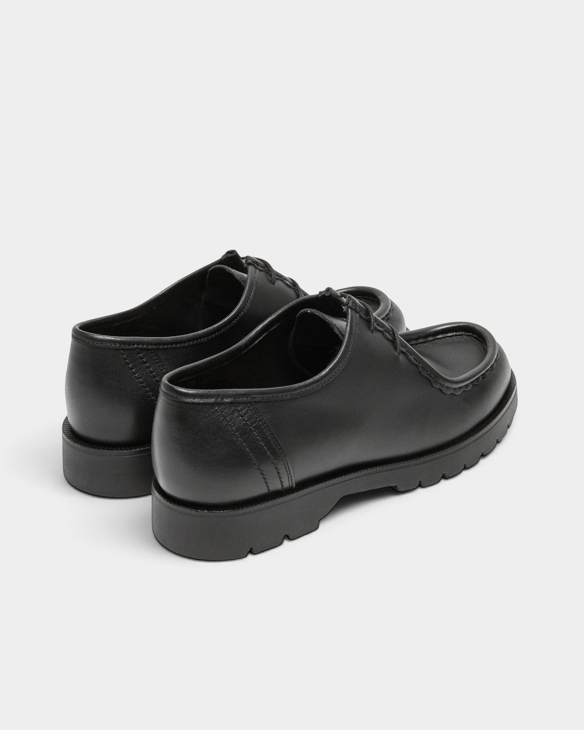 Lockwood Avenue Kleman Padror black full-grain leather derby shoes with chunky rubber lug soles and apron toe detail.