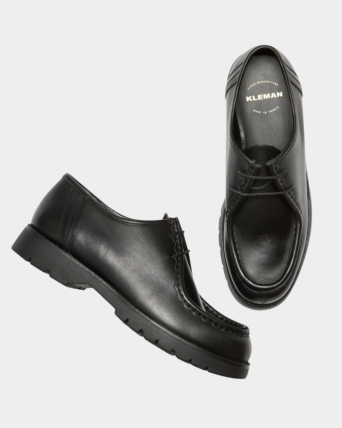 Lockwood Avenue Kleman Padror black full-grain leather derby shoes with chunky rubber lug soles and apron toe detail.