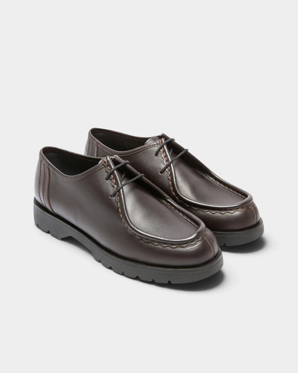 Lockwood Avenue Kleman Padror brown leather derby shoes with apron toe, serrated stitching, and chunky black lug sole.